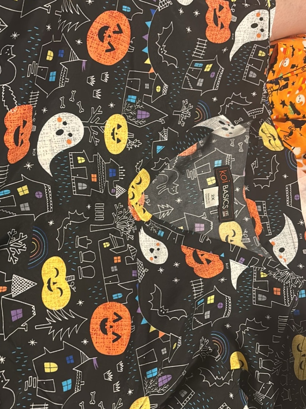 koi Halloween Print Scrub Top in Black with Orange, Yellow, White Accents